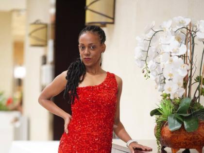 Singer Keisha Patterson, following her well-received Jazz in the Gardens performance at The Jamaica Pegasus, stuns in red-hot evening wear. 