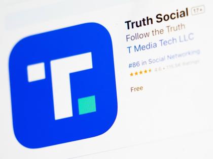 The download screen for the Truth Social app is displayed on a laptop in March 2024 in New York.  