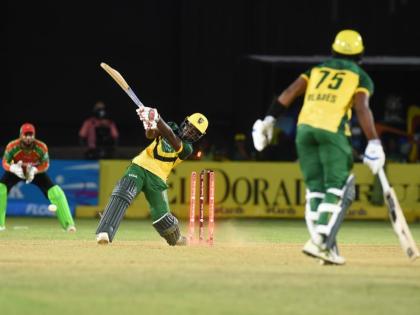 Jamaica Kingsmen's Vitel Lawes (left) has his stumps uprooted in the final over of their Republic Bank Caribbean Premier League cricket game at Sabina Park earlier tonight. 