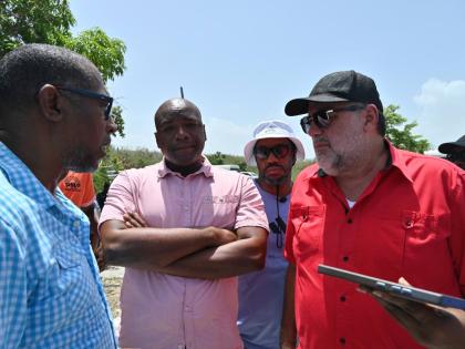 From left: Garth Wilkinson, councillor for Falmouth Division; Lothan Cousins, opposition spokesperson on land; Isat Buchanan, opposition spokesperson on youth and human rights; and Mark Golding, opposition leader, in conversation during a tour of Cooper’