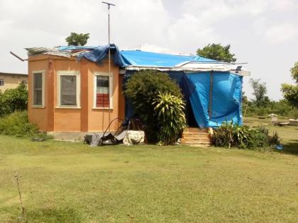 The house on the property lost its roof to Hurricane Melissa.