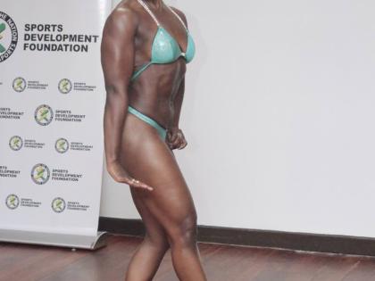 Athlete and Event Coordinator Malene Carr strikes a side pose during a live category demonstration at the official press launch for the 2026 Mayberry JABBFA National Senior Championship at The Liguanea Club recently. 