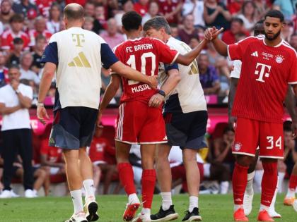 Bayern Munich’s Jamal Musiala (centre) leaves the pitch due to an injury during a pre-season  match between FC Bayern Munich and RB Leipzig in Munich, Germany, Saturday, August 15, 2026. 