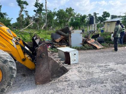 Bulky waste, including old appliances and other discarded household items, along Strathbogie Lane as residents work to clear the area.