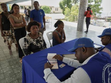 Haitians register to vote in the upcoming general election in Port-au-Prince, Haiti, July 30.