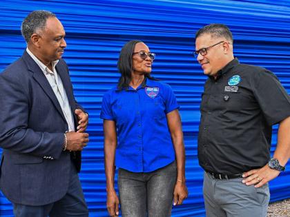 Minister of Water, Environment and Climate Change, Matthew Samuda (right), in conversation with Principal of the Bunkers Hill Primary and Infant School in Clarendon, Nathalia Lewis (centre), while Chairman of the Rural Water Supply Limited, Omar Sweeney, l
