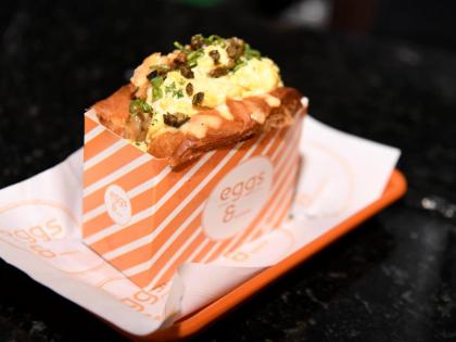 The salmon cake sandwich layers the restaurant’s signature scrambled egg with a salmon cake, Swiss cheese and caramelised pineapple on toasted brioche.