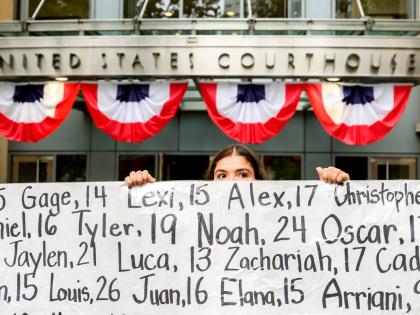 Olivia Konar holds a banner with names of young people who advocates say died as a result of social media outside the Ronald V. Dellums Federal Building and US Courthouse on Tuesday, August 18, in Oakland, California. Her sister Coco Konar died in 2022 whe