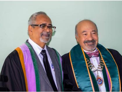 Dr Delroy Fray (left) sharing a light moment with Dr.Julio Rodrigues, the global president of the International College of Dentists (ICD), after receiving his ICD fellowship citation.