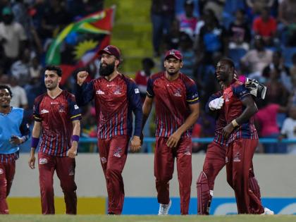 Antigua and Barbuda Falcons captain Moeen Ali (second left) pumps a fist in celebration of beating the Barbados Tridents at the end of a Republic Bank Caribbean Premier League match at the Sir Vivian Richards Stadium on Tuesday.