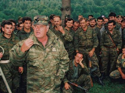 Bosnian Serb General Ratko Mladic speaks to soldiers near the Bosnian town of Cazin, September 4, 1994.