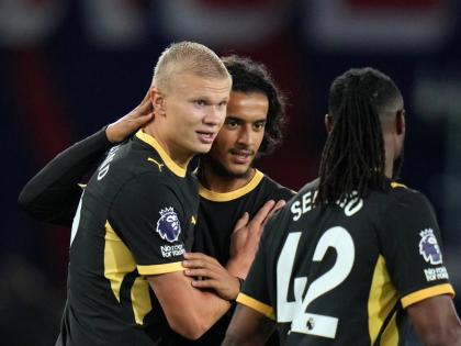 Manchester City’s Erling Haaland (left) celebrates with Avyoub Bouaddi and Antoine Semenyo (right, after sco)ing his side’s fourth goal during the English Premier League  match between Crystal Palace and Manchester City in London yesterday.