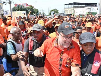 
People’s National Party (PNP) President Mark Golding surrounded by supporters during Nomination Day activities on August 18.
