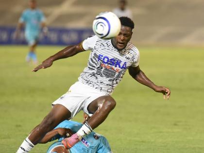 Rajay Wright of Cavalier FC is brought down by a sliding tackle from Frank Salas of Sacedo FC during their Concacaf Caribbean Cup football match at the National Stadium on August 20.