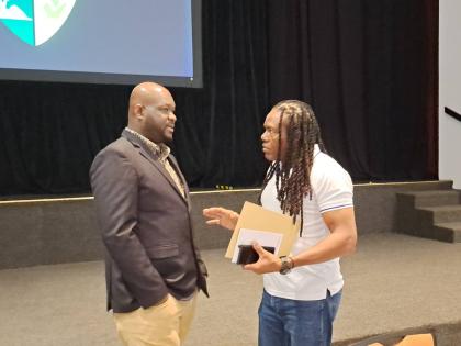 O’Brian Heron (left), the president of the Jamaica Hotel and Tourist Association (JHTA), chats with Lindsay McFarlane, executive director of SNL Jamaican Tours Limited, following the JHTA’s annual general meeting at the Half Moon Hotel in Montego Bay, 