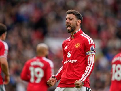 Manchester United’s Bruno Fernandes celebrates after scoring his side’s third goal during the English Premier League soccer match between Manchester United and Ipswich Town in Manchester, England, Sunday, August 30, 2026. 