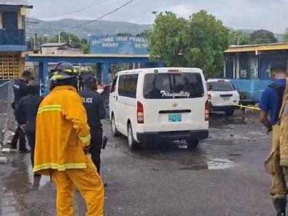Police and firefighters at Balcombe Drive Primary and Junior High School in Olympic Gardens, St Andrew, where the section of a building collapsed, killing a man and injuring another on September 1.