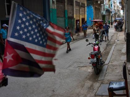 People walk on the street during a blackout in Havana, Cuba, Monday, July 6, 2026. (AP Photo/Ramon Espinosa)