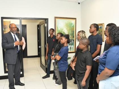 Earl Jarrett, chief executive officer of the JN Group, speaks with participants in the Valda Mae Cares Foundation’s (VMCF) NextGen Leadership Programme during their visit to the JN Group Corporate Offices in New Kingston recently. 