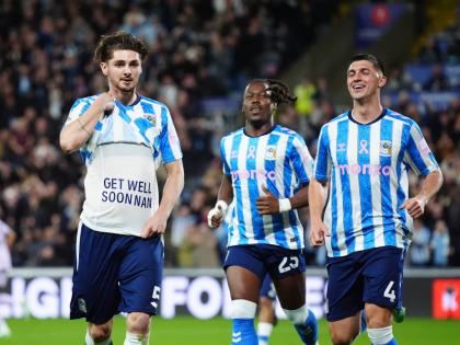 Coventry City’s Jack Rudoni (left) celebrates after scoring the opening goal during the English Premier League football match against Newcastle United in Coventry, England, yesterday.