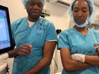 Ophthalmologist Dr David Burton (left) makes a point to Nurse Saschauna Hamilton during a medical mission at the Cornwall Regional Hospital in Montego Bay earlier this year.