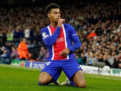 PSG's Desire Doue celebrates after scoring his side's opening goal during the Champions League opening phase soccer match between Manchester City and Paris Saint-Germain in Manchester, England, on Wednesday.
