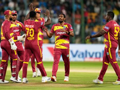 AP 
West Indies’ Keemo Paul (second right) celebrates with teammates the dismissal of India’s Abhishek Sharma during the fifth T20 International cricket match against India in Bengaluru, India, yesterday.