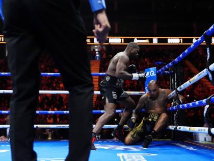 AP 
Boxer Daniel Dubois (left) knocks down Fabio Wardley during their WBO world heavyweight bout in London yesterday. 