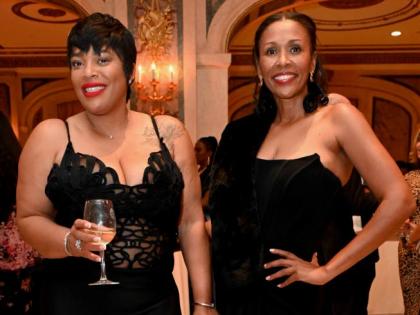 Judine Campbell-Stevenson (left) and Monique Daley coordinate in elegant black Mac Duggal gowns.