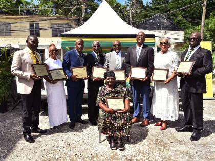 Recipients of Hanover’s National Heroes Day awards are (from left) Horace Thompson, Dr Valrie Miller, Stennett Rowe, Rev Sheldon Sean Ashman, Vernon Fletcher, Moncrieffe Leslie, Hyacinth Shakes-Warren, and Delroy Pinnock. Seated is Hyacinth Whyte-McKenzi