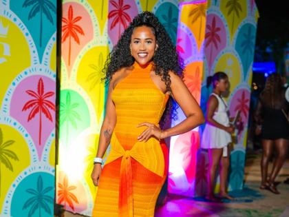 Bonnie Lee, operations manager at Boss Destinations, poses for the camera in a sunset halter dress.