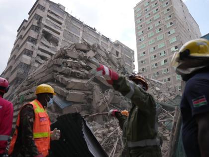 Security forces and civil defence work after a multi-story building collapsed in Nairobi, Kenya, Friday.