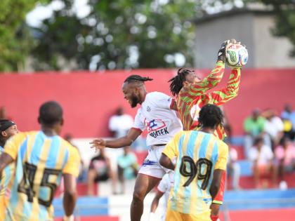 
Waterhouse goalkeeper Akeem Bernard goes high to catch the ball during a Jamaica Premier League match against Portmore United on October 8 at Ferdi Neita Park in St Catherine. 
