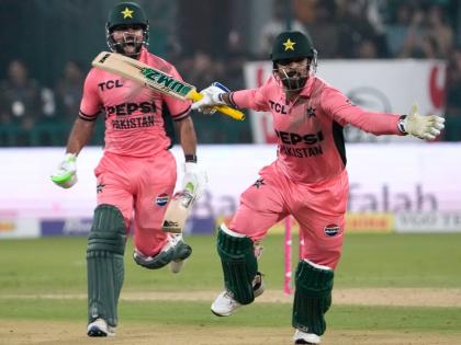 Pakistan’s Shadab Khan and Haris Rauf celebrate after winning the tri-series One-Day International cricket match against England, in Lahore, Pakistan, yesterday.