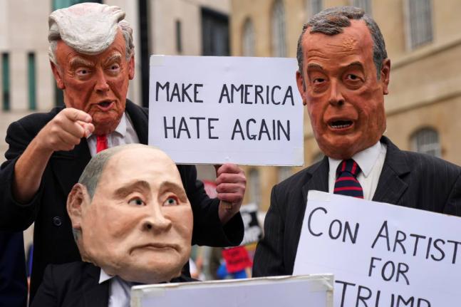 Protesters wear masks of politicians during a demonstration of the Stop Trump Coalition group against President Donald Trump's state visit in London, Wednesday, September 17, 2025.(AP Photo/Joanna Chan)