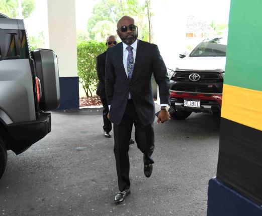 Dr Andrew Wheatley, arriving at King’s House yesterday, shortly before being sworn in as minister without portfolio in the Office of the Prime Minister, with responsibility for science, technology and special projects. 
