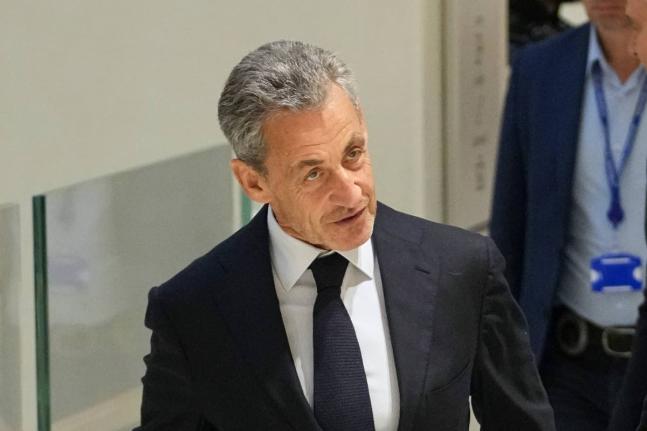 Former French President Nicolas Sarkozy arrives at the courthouse, in Paris, France, Thursday, September 25, 2025. (AP Photo/Christophe Ena)