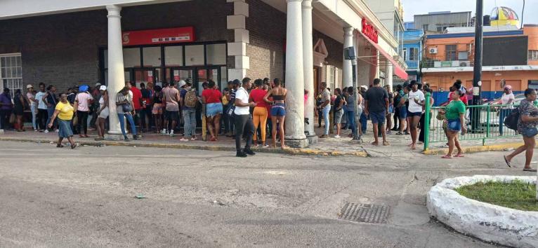 Dozens queue up for cash at Scotiabank ATM in Sam Sharpe Square, Montego Bay, the tourism capital of the island. 