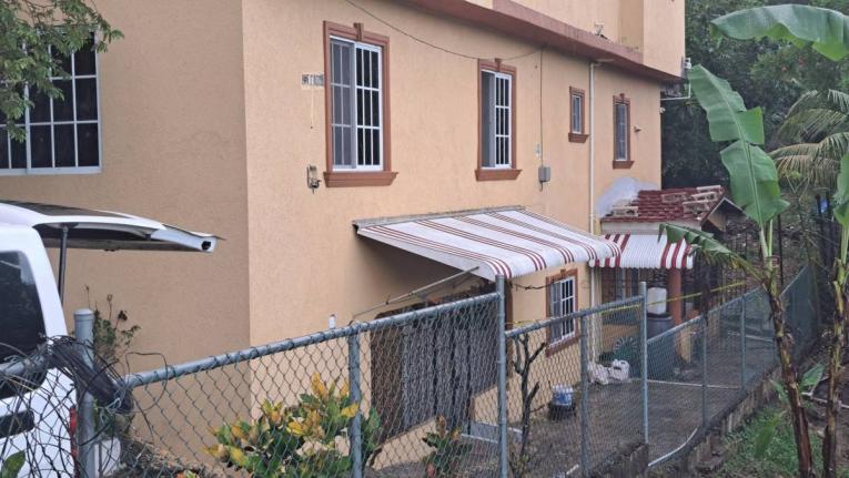 The lower floor apartment where mother and daughter were discovered dead in the Keystone area of Spanish Town, St Catherine, on Thursday.