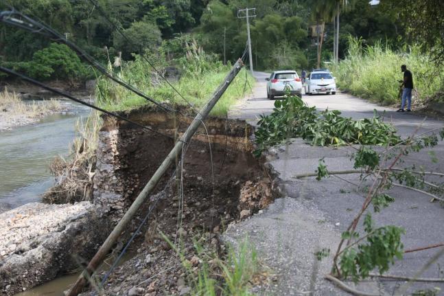 A light pole which was washed away during the passage of Hurricane Melissa sits on the side of a road in Pennants, Clarendon.