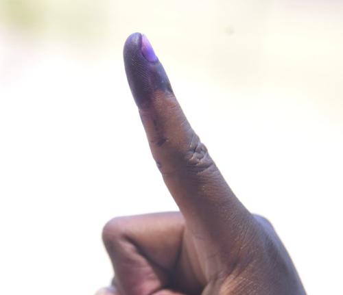 
A voter shows off his inked finger after voting in the general elections on September 3, 2025.