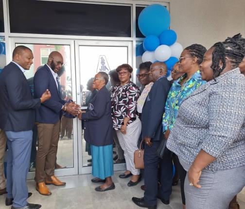 From left: Mark Smith, immediate past president of the Jamaica Teachers’ Association (JTA); Mark Malabver, president of the JTA; and Evelyn Tugwell, retired JTA western regional officer, cut the ribbon to reopen the JTA’s Western Regional Office in Mon