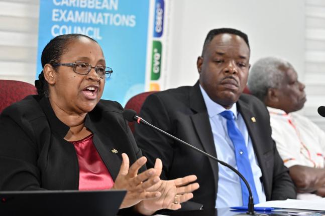 From left: Dr Nicole Manning, director of operations at the Caribbean Examinations Council (CXC), addresses the media as Dr Wayne Wesley, registrar and CEO of CXC; and Everton Hannam, president of the Caribbean Council of National PTAs, look on during a pr