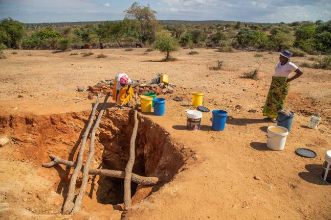 Villagers fetch water from a makeshift borehole in Mudzi, Zimbabwe, in 2024. as the United Nations' food agency says months of drought in southern Africa, triggered by the El Niño weather phenomenon, has had a devastating impact on more than 27 million pe