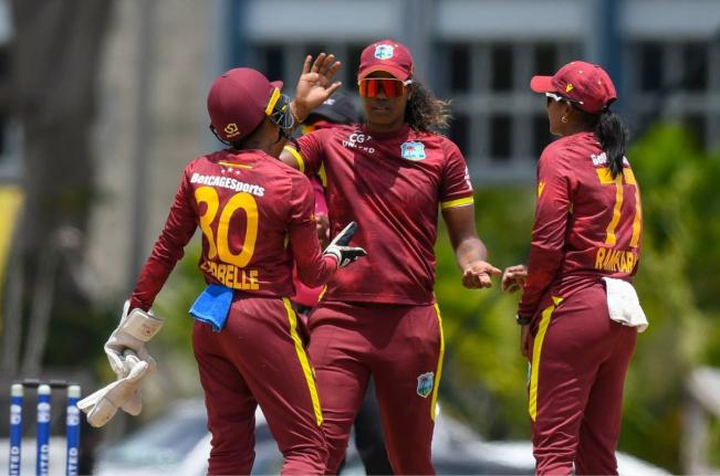 West Indies Women’s captain Hayley Mathews (centre) is congratulated by wicketkeeper Shemaine Campbelle and Karishma Ramharack.