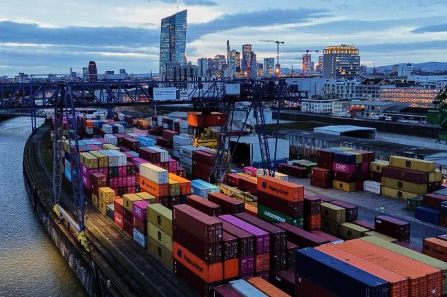 Containers are stored in a cargo terminal in Frankfurt, Germany, Monday, February 23, 2026. (AP Photo/Michael Probst)