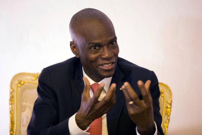 In this August 28, 2019, file photo, Haiti's President Jovenel Moïse  speaks during an interview in his office in Port-au-Prince, Haiti. (AP Photo/Dieu Nalio Chery, File)