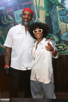 Chef Scotley Innis (left) poses with reggae star Lila Iké.