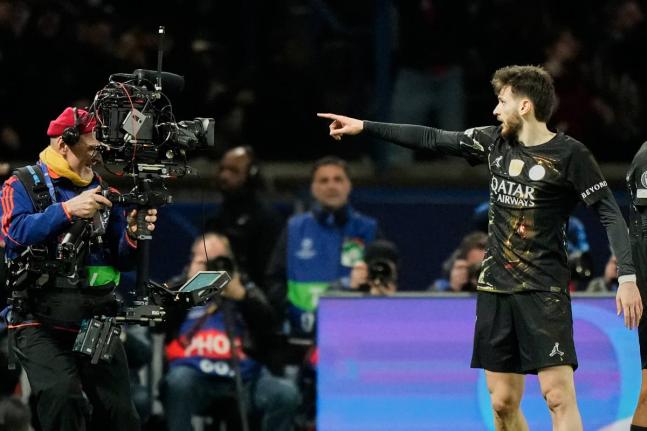 PSG’s Khvicha Kvaratskhelia celebrates after scoring his side’s fourth goal during the first leg of the Champions League round-of-16 match against Chelsea in Paris on Wednesday.