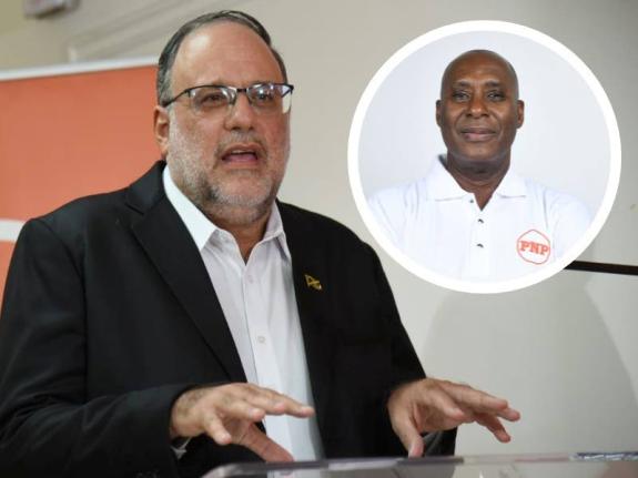 Opposition Leader Mark Golding and Member of Parliament Dennis Gordon (encircled). 